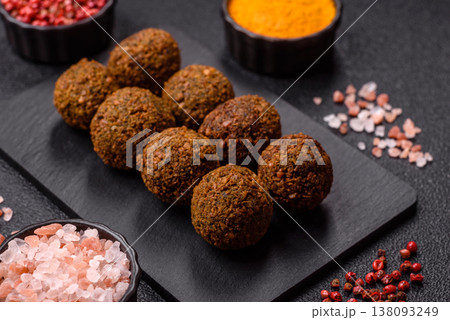 Falafel, a hearty Arabic dish made from boiled chickpeas for vegetarians. Chickpea falafel Falafel, a hearty Arabic dish made from boiled chickpeas for vegetarians. Chickpea falafel 138093249