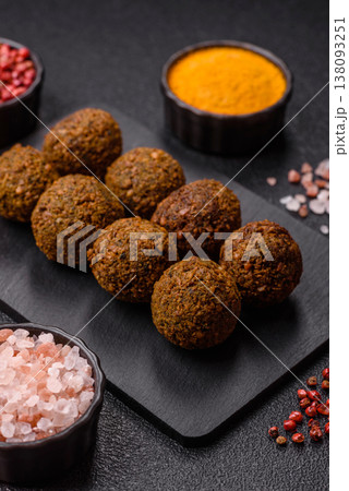 Falafel, a hearty Arabic dish made from boiled chickpeas for vegetarians. Chickpea falafel Falafel, a hearty Arabic dish made from boiled chickpeas for vegetarians. Chickpea falafel 138093251