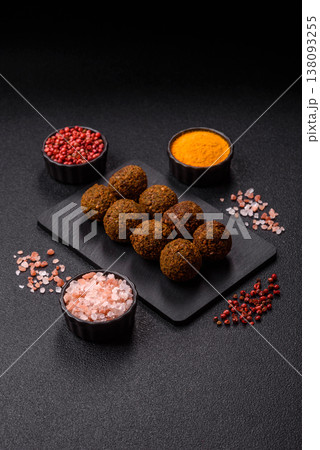 Falafel, a hearty Arabic dish made from boiled chickpeas for vegetarians. Chickpea falafel Falafel, a hearty Arabic dish made from boiled chickpeas for vegetarians. Chickpea falafel 138093255
