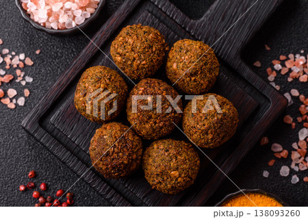 Falafel, a hearty Arabic dish made from boiled chickpeas for vegetarians. Chickpea falafel Falafel, a hearty Arabic dish made from boiled chickpeas for vegetarians. Chickpea falafel 138093260