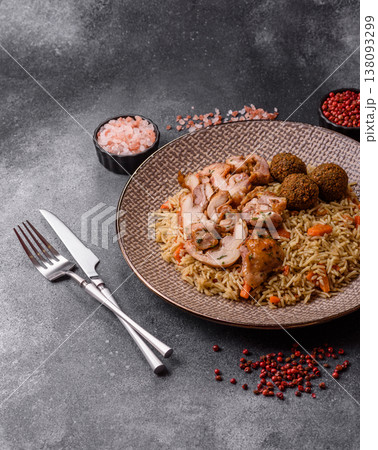 Kabsa or mandi, an Arabic dish with rice and chicken, salt, and spices. Kabsa or mandi Kabsa or mandi, an Arabic dish with rice and chicken, salt, and spices. Kabsa or mandi 138093299