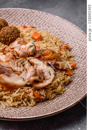 Kabsa or mandi, an Arabic dish with rice and chicken, salt, and spices. Kabsa or mandi 138093305