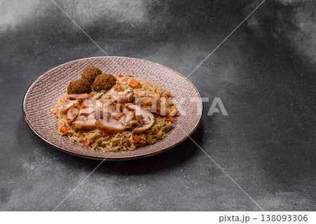 Kabsa or mandi, an Arabic dish with rice and chicken, salt, and spices. Kabsa or mandi 138093306