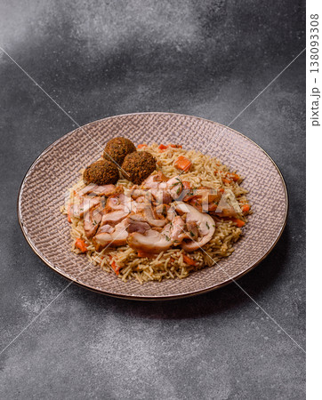 Kabsa or mandi, an Arabic dish with rice and chicken, salt, and spices. Kabsa or mandi Kabsa or mandi, an Arabic dish with rice and chicken, salt, and spices. Kabsa or mandi 138093308