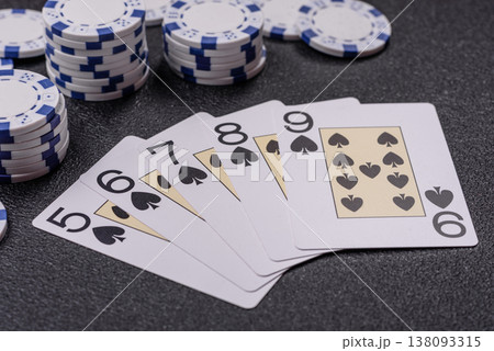 Playing cards and chips on a table, a gambling game of poker. Cards and chips Playing cards and chips on a table, a gambling game of poker. Cards and chips 138093315