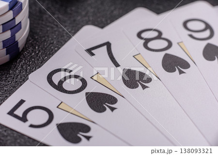 Playing cards and chips on a table, a gambling game of poker. Cards and chips Playing cards and chips on a table, a gambling game of poker. Cards and chips 138093321