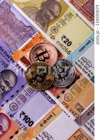 A conceptual financial background, Bitcoin against the Rupee. Bitcoin on the Indian currency A conceptual financial background, Bitcoin against the Rupee. Bitcoin on the Indian currency 138093674