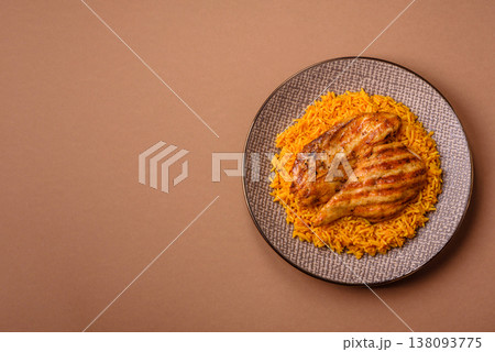 Kabsa or haneeth, an Arabic dish with rice and chicken, salt, and spices. Kabsa or haneeth Kabsa or haneeth, an Arabic dish with rice and chicken, salt, and spices. Kabsa or haneeth 138093775