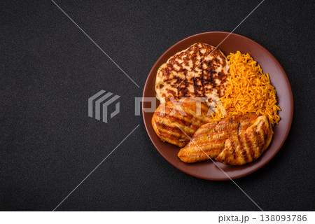 Dajaj Mashwi, an Arabic dish with rice and chicken, salt, and spices. Dajaj Mashwi as a background Dajaj Mashwi, an Arabic dish with rice and chicken, salt, and spices. Dajaj Mashwi as a background 138093786