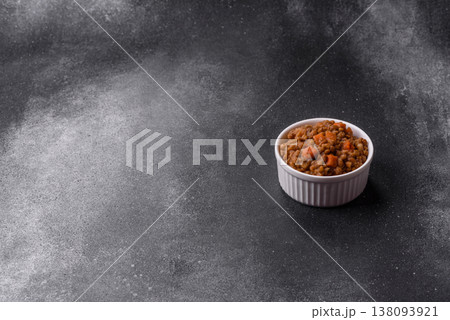 Lentil, carrot, and tomato stew with sausages, a European dish. Lentils with sausages Lentil, carrot, and tomato stew with sausages, a European dish. Lentils with sausages 138093921