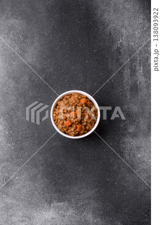 Lentil, carrot, and tomato stew with sausages, a European dish. Lentils with sausages 138093922