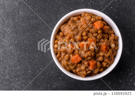 Lentil, carrot, and tomato stew with sausages, a European dish. Lentils with sausages 138093925