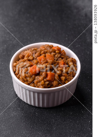 Lentil, carrot, and tomato stew with sausages, a European dish. Lentils with sausages Lentil, carrot, and tomato stew with sausages, a European dish. Lentils with sausages 138093926
