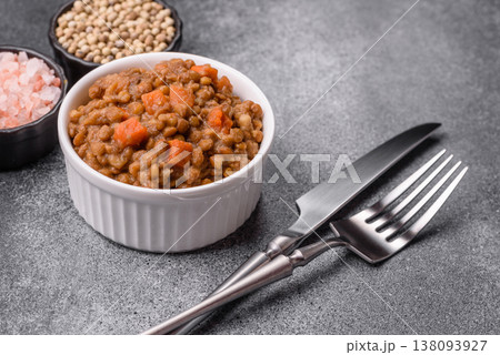 Lentil, carrot, and tomato stew with sausages, a European dish. Lentils with sausages Lentil, carrot, and tomato stew with sausages, a European dish. Lentils with sausages 138093927