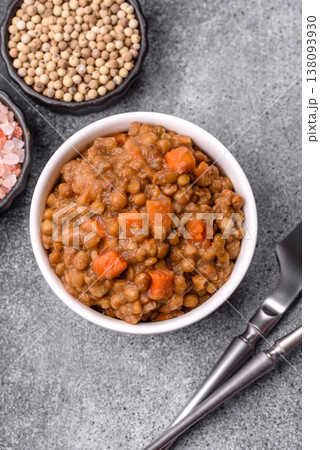 Lentil, carrot, and tomato stew with sausages, a European dish. Lentils with sausages Lentil, carrot, and tomato stew with sausages, a European dish. Lentils with sausages 138093930