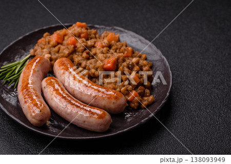 Lentil, carrot, and tomato stew with sausages, a European dish. Lentils with sausages Lentil, carrot, and tomato stew with sausages, a European dish. Lentils with sausages 138093949