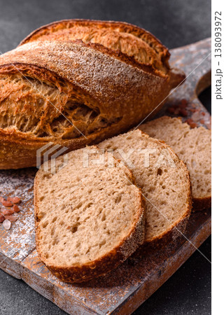 A loaf of homemade whole grain rye bread for the dinner table. A loaf of rye bread A loaf of homemade whole grain rye bread for the dinner table. A loaf of rye bread 138093972