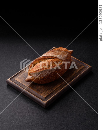 A loaf of homemade whole grain rye bread for the dinner table. A loaf of rye bread A loaf of homemade whole grain rye bread for the dinner table. A loaf of rye bread 138093981