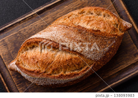 A loaf of homemade whole grain rye bread for the dinner table. A loaf of rye bread 138093983