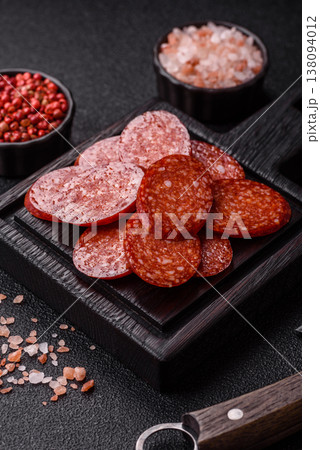 Sliced smoked pepperoni or salami as a pizza topping. Pepperoni sausage Sliced smoked pepperoni or salami as a pizza topping. Pepperoni sausage 138094012