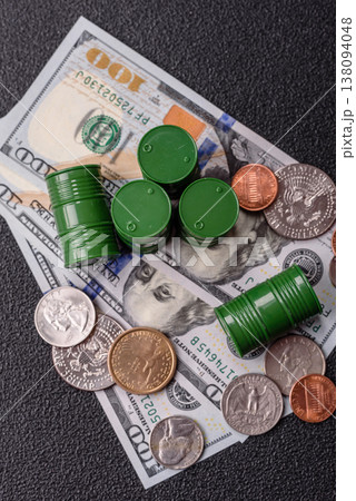 A barrel of oil against a backdrop of dollars as a concept for the oil crisis. A barrel of oil 138094048
