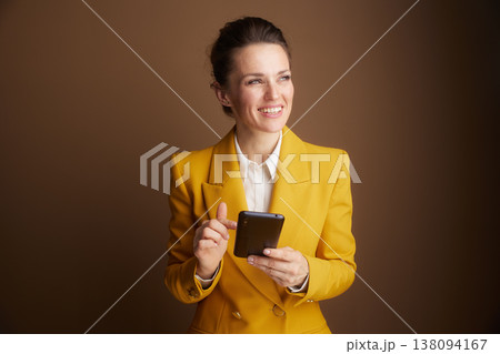 Focused Businesswoman Interacting with Smartphone Focused Businesswoman Interacting with Smartphone 138094167