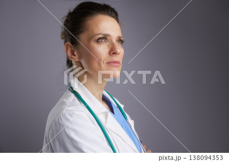Profile Portrait of Thoughtful Female Doctor Looking Up Profile Portrait of Thoughtful Female Doctor Looking Up 138094353