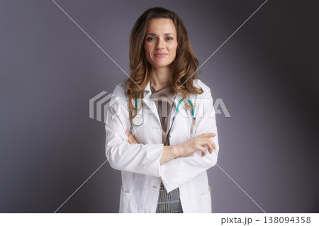 Confident Female Physician in Lab Coat with Arms Crossed Confident Female Physician in Lab Coat with Arms Crossed 138094358