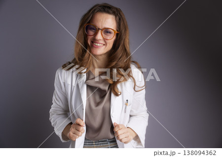 Professional Female Healthcare Provider Holding Lab Coat Lapels Professional Female Healthcare Provider Holding Lab Coat Lapels 138094362