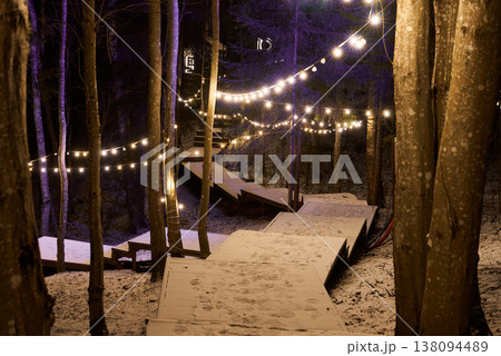 Quiet winter forest with glowing lights and relaxing atmosphere Quiet winter forest with glowing lights and relaxing atmosphere 138094489