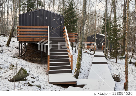 Serene retreat with snowcovered path linking cabin residences Serene retreat with snowcovered path linking cabin residences 138094526
