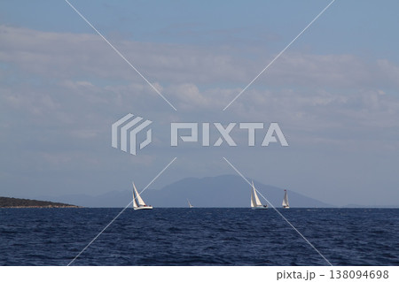 Close up on the bow of a sailboat breaking through a wave Close up on the bow of a sailboat breaking through a wave 138094698