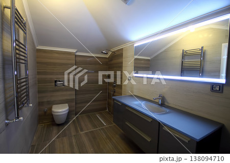 Modern minimalist bathroom with bathtub and clear tiles. Nobody inside Modern minimalist bathroom with bathtub and clear tiles. Nobody inside 138094710
