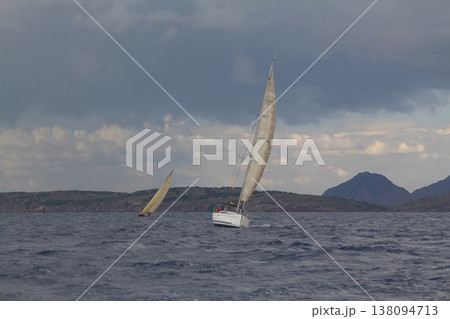 Close up on the bow of a sailboat breaking through a wave Close up on the bow of a sailboat breaking through a wave 138094713