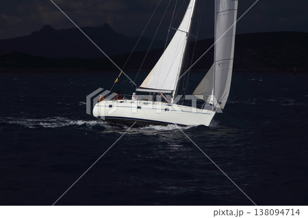 Close up on the bow of a sailboat breaking through a wave 138094714