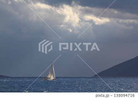 Close up on the bow of a sailboat breaking through a wave Close up on the bow of a sailboat breaking through a wave 138094716