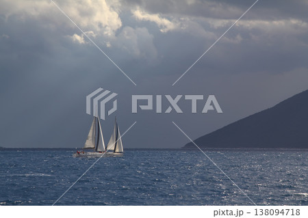 Close up on the bow of a sailboat breaking through a wave Close up on the bow of a sailboat breaking through a wave 138094718