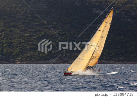 Close up on the bow of a sailboat breaking through a wave 138094719