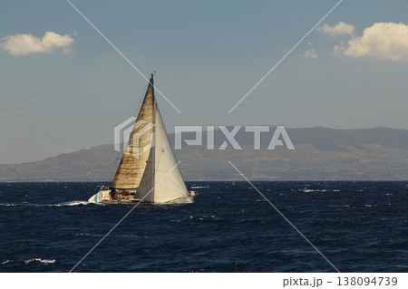 Sailboats sail in windy weather in the blue waters of the Aegean Sea, on the shores of the famous holiday destination Bodrum. Sailboats sail in windy weather in the blue waters of the Aegean Sea, on the shores of the famous holiday destination Bodrum. 138094739