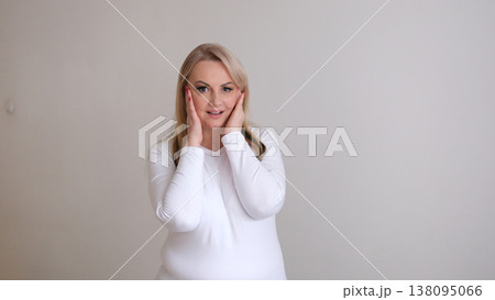 Facial lift concept mature woman stretching skin smiling beauty care anti-aging grey background wellness lifestyle Facial lift concept mature woman stretching skin smiling beauty care anti-aging grey background wellness lifestyle 138095066