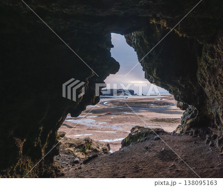 View from Loftsalahellir cave with Dyrholaey peninsula in the background, South Iceland. 138095163