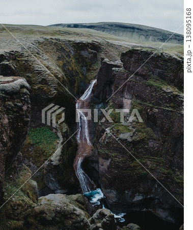 Moss-covered Mogafoss waterfall cascading through rugged cliffs, South Iceland. Moss-covered Mogafoss waterfall cascading through rugged cliffs, South Iceland. 138095168