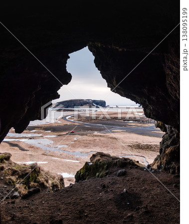 View from Loftsalahellir cave with Dyrholaey peninsula in the background, South Iceland. 138095199