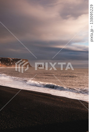 Reynisfjara black sand beach with Reynisdrangar sea stacks, South Iceland. Reynisfjara black sand beach with Reynisdrangar sea stacks, South Iceland. 138095229