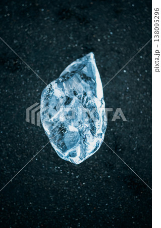 Close-up of glacial ice on the black sands of Diamond Beach, South Iceland. 138095296