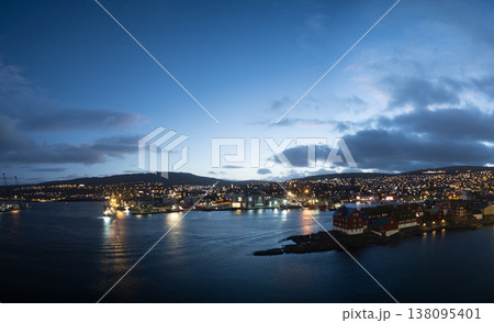Twilight panorama of Thorshavn, lights reflecting on harbor waters 138095401