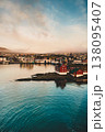 Aerial sunset view of Torshavn, showcasing colorful architecture and serene coastline. 138095407
