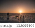 Couple enjoys serene sunset on Faroe Islands ferry deck 138095409