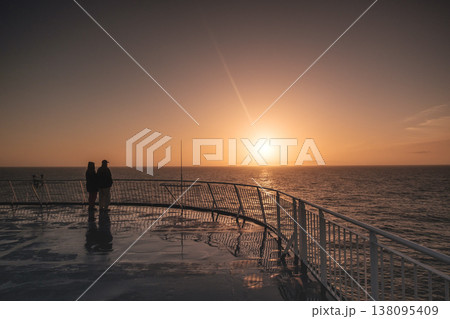 Couple enjoys serene sunset on Faroe Islands ferry deck Couple enjoys serene sunset on Faroe Islands ferry deck 138095409