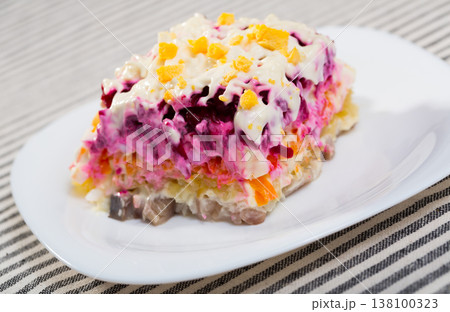 Dressed herring salad 138100323